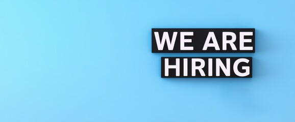 Bold 'We Are Hiring' Message on a Light Blue Background for Recruitment Marketing