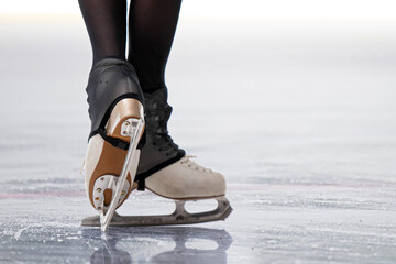 Figure skaters skates while sliding on ice - professional figure skating