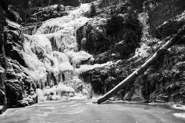 Frozen Kamieńczyk Waterfall in Winter in the Karkonosze Mountains