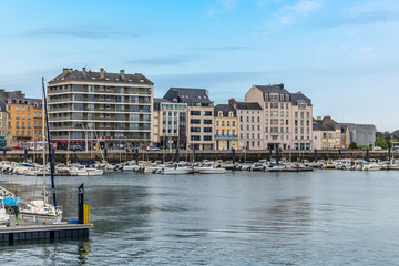 A view towards buildings on the shore of the middle inner harbor  at Cherbourg, France in autumn