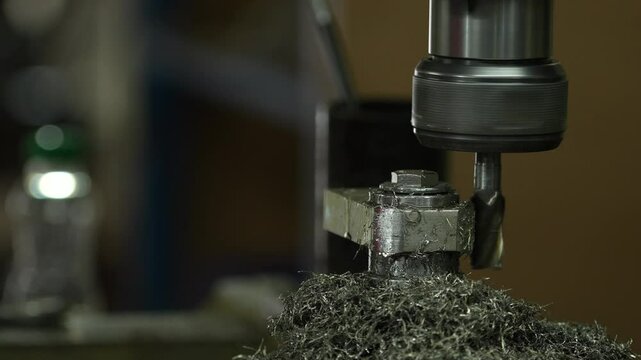 VDO 4K Lathe is working on turning metal parts for industrial use.