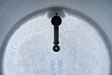 Frosty pattern on window porthole in the winter