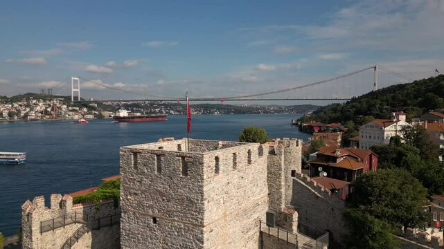 Anadolu Hisari fortress near the Bosphorus, with a bridge and waterfront urban scenery, oe01