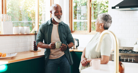 Senior, couple and talking with coffee in kitchen for communication, morning start and bonding together. Elderly people, discussion and caffeine drink for wellness, affection and retirement at house