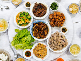 A Chinese New Year Eve Family Dinner with A Table Full of Chinese Traditional Dishes