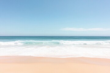 Fototapeta premium soft pastel waves gently roll over sandy beach creating serene and calming scene with clear blue skies overhead providing