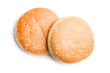 Empty burger bun with sesame seeds isolated on white background.