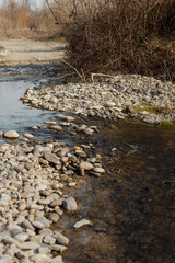 a small river flows from the mountains