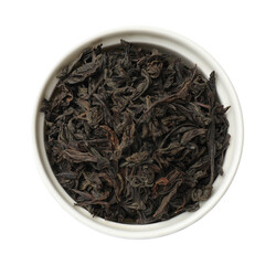 Dry tea leaves in bowl isolated on white, top view