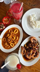 Plate of Squid and Plate of Shrimp – Fresh Seafood Delight

Close-up photo of fresh seafood featuring a plate of squid and a plate of prawns, served with simple seasonings to highlight the original.