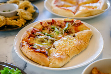 Supreme beef pepperoni pizza with onion, mushroom and mozzarella cheese