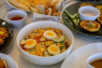 Serve salads with heavy food on the table