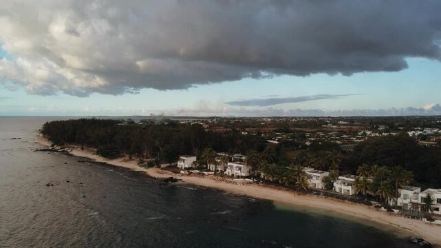 Aerial view in Mauritius over Pointe aux Piments beach at sunset, a beautiful tropical beach in the Indian Ocean