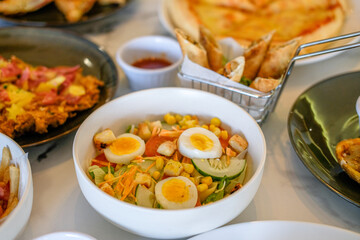 Serve salads with heavy food on the table