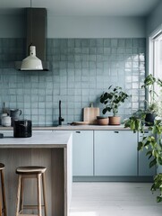 A modern kitchen showing a beautiful blue colored backsplash