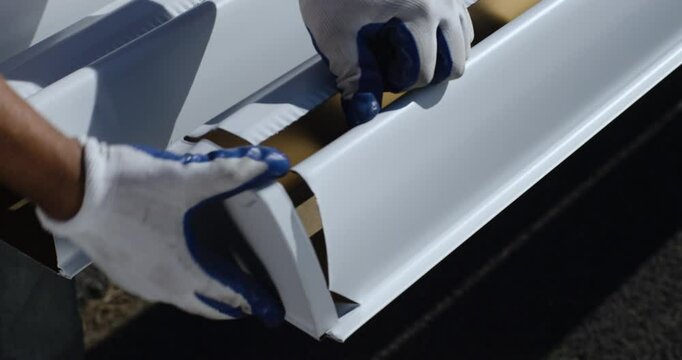 man assembling gutter