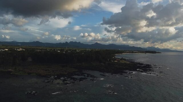 Aerial view in Mauritius over Pointe aux Piments beach at sunset, a beautiful tropical beach in the Indian Ocean