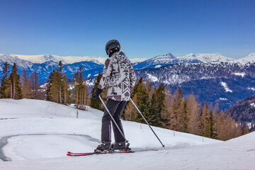 Skiers Enjoying Snowy Mountain Slopes