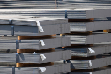 A stack of metal sheets with a white label on them