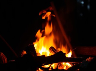 Fototapeta premium Vibrant Campfire Flames at Night, Outdoor Adventure and Warmth in the Darkness