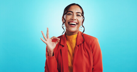 Studio, happy woman and portrait with sign for approval, agreement or affirmation for college with...