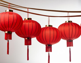 row of traditional red lanterns hanging on a string symbolizing celebration and good fortune against a white background