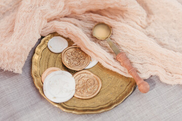 Aesthetic flat lay composition featuring a vintage golden tray with intricate engravings, holding...