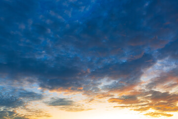 Fototapeta premium Cloud and sky backdrop,Beautiful Vivid sky painted by the sun leaving bright golden shades