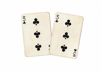 A pair of identical vintage playing cards on a white background.