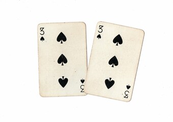 A pair of identical vintage playing cards on a white background.