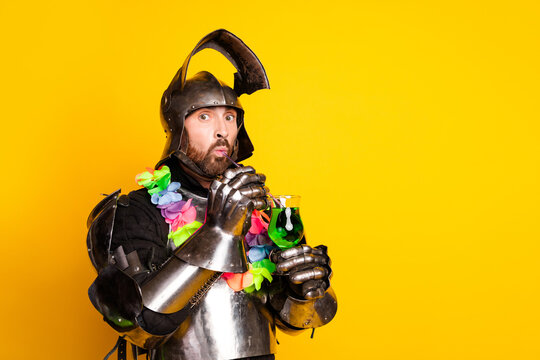 Humorous depiction of a knight enjoying a modern party with colorful accessories on a vibrant yellow background