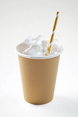 Disposable paper cup filled with ice and a straw. Generative AI