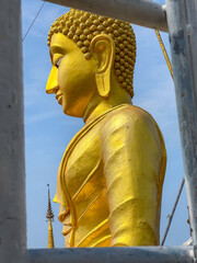 The buddha at the top of Tiger cave temple. Wat Tham Seua (Tiger Cave) is at Krabi, Thailand 