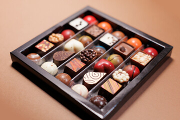 arranged selection of gourmet chocolates with various shapes and colors