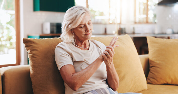 Senior woman, hand pain and arthritis in home, orthopedic joint inflammation and check wrist damage. Muscle, carpal tunnel and elderly person with injury accident, rheumatoid and poor circulation