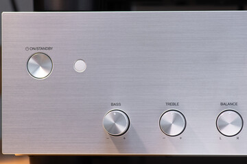 Close-Up of Audio Amplifier Controls for Bass, Treble, and Balance Adjustment