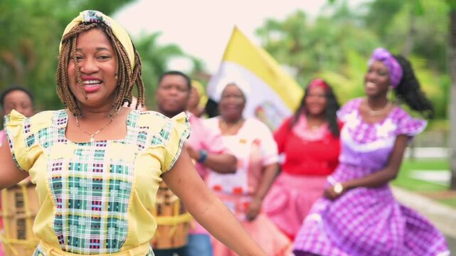 Beautiful Latina girl of the Garifuna ethnic group dances to the rhythm of the music.