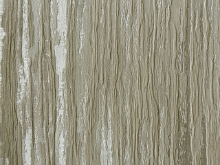 Close up of 3d textured bark sewn fabric with linear veins and grunge brown grey background. Seamless background texture