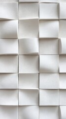 Intricate patterns of folded paper create a mesmerizing abstract design in soft white tones