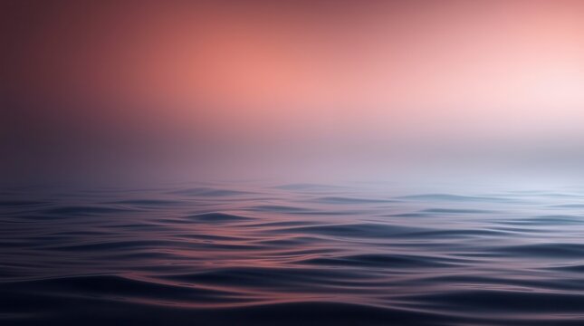 Gentle ocean waves roll under a dreamy pink and purple sky, creating a serene and calming seascape.