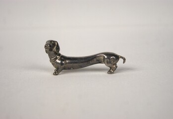 Silver Dachshund figurine. Knife rest cutlery.