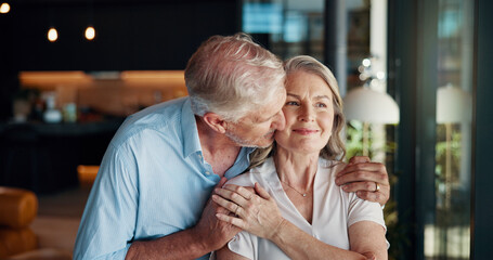 Kiss, hug and senior couple in home, bonding and mature people with love and romance for...