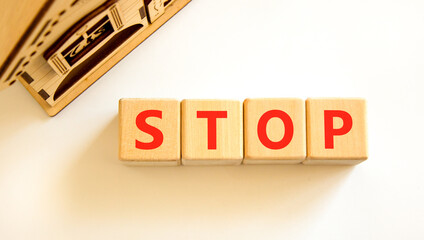 Stop symbol. Concept word Stop on beautiful wooden blocks. Beautiful wooden house. Beautiful white...