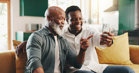 Happy, black family and father with phone on sofa for social media, network or app assistance at...