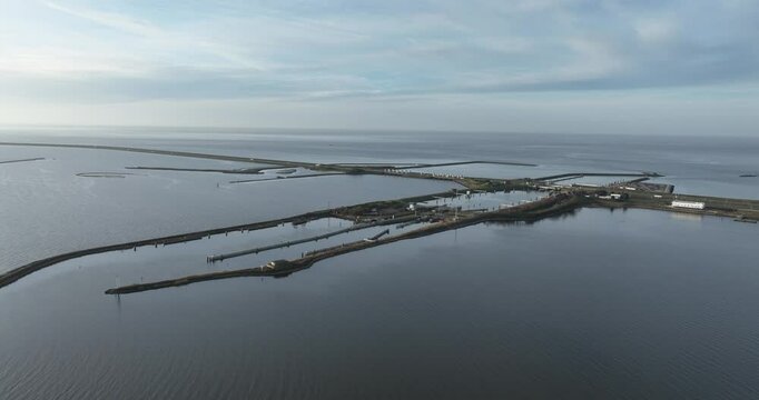Lorentz locks, water way, transportation infrastructure at the Afsluitdijk, Kornwerderzand, Friesland, The Netherlands. Aerial drone view.