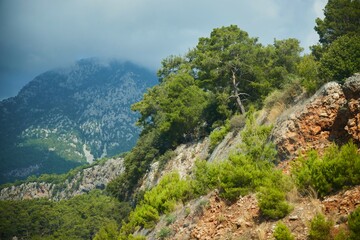 A high mountain in the fog. Southern nature of Turkey