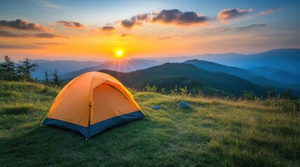Serene camping adventure at sunrise with orange tent and majestic mountain range in background capturing the spirit of outdoor exploration and natural beauty