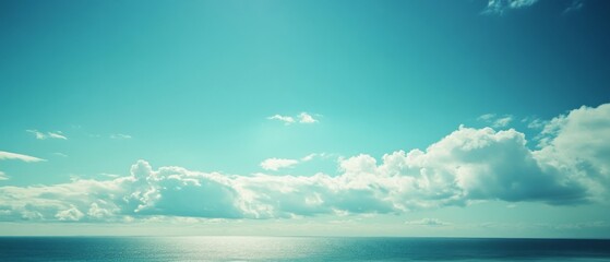 Expansive sky meets tranquil sea in this serene landscape, evoking calm and introspection.