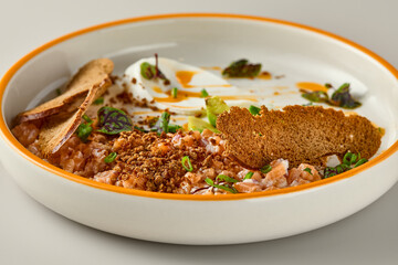 Elegant Salmon Tartare Presentation with Flaxseed Crisps in Natural Lighting