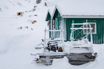 Green cabin, dog sleds and huskies in Sisimiut Greenland © Sarah Østergaard